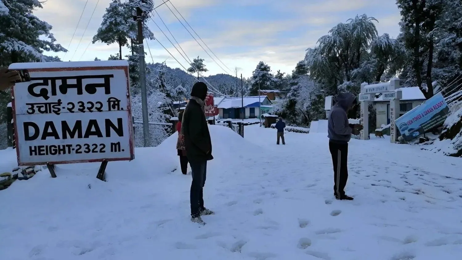 Daman in Nepal covered in fresh snow with visitors walking through the snowy landscape