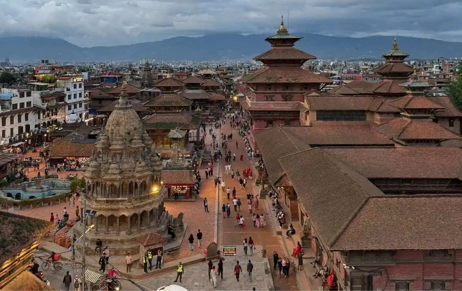 Patan Durbar Square with traditional Newari temples and Kathmandu Valley backdrop
